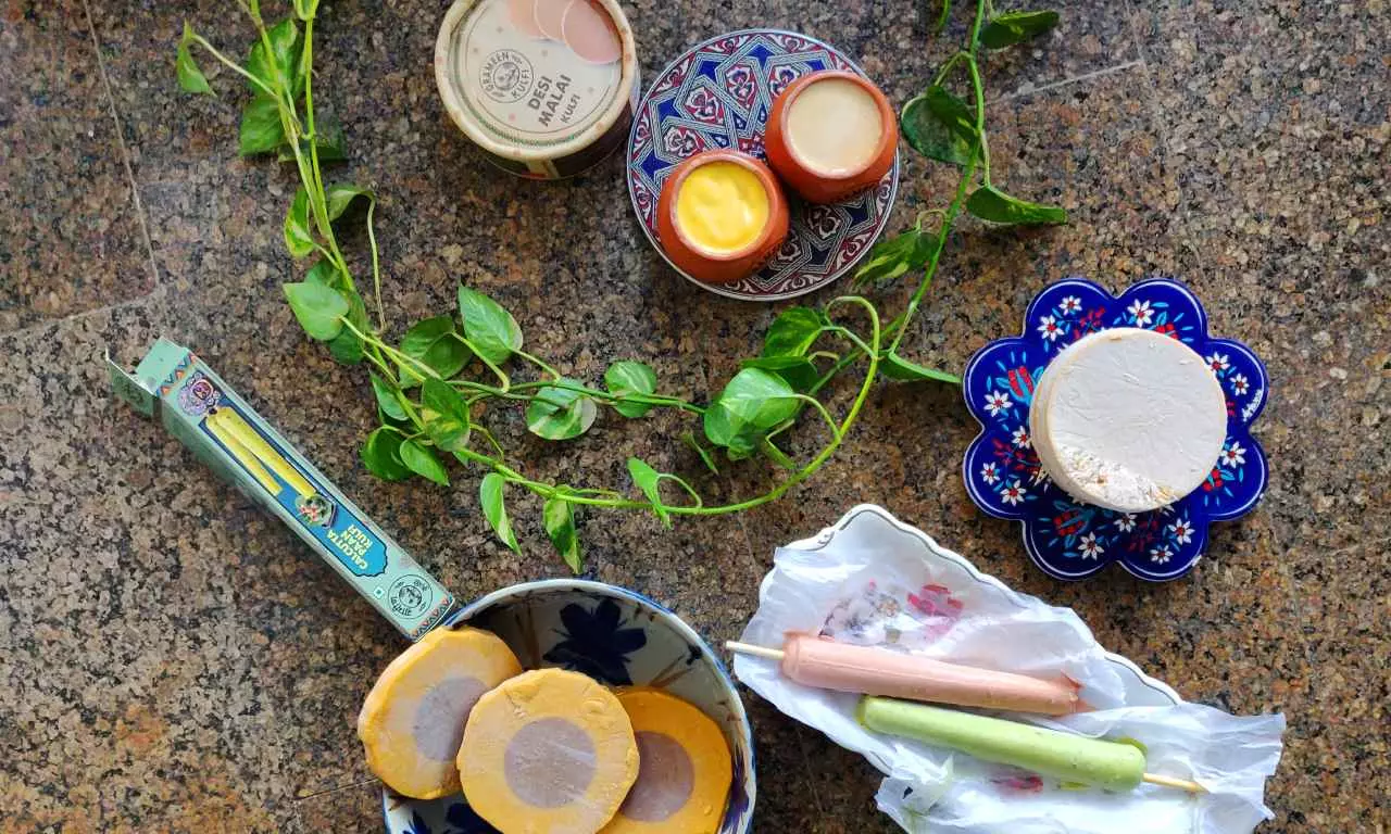 A top-shot of kulfi spread out - malai, mango, shahi gulkand, Calcutta Pan, 2-in-1 kulfi A top-shot of kulfi spread out - malai, mango, shahi gulkand, Calcutta Pan, 2-in-1 kulfi